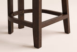 Close-up of the Gradisca front leg, rear legs and D-shaped footring with two small brass-tone bolts in Espresso