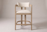 Gradisca horseshoe counter stool in Natural Ash, straight front view on a studio backdrop