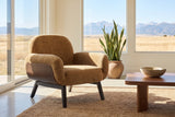 Grado chair on a jute rug in a Calgary foothills living room with windows onto grassland and the Rockies