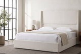 Greve wingback bed made up with white linen in a loft bedroom with a steel factory window