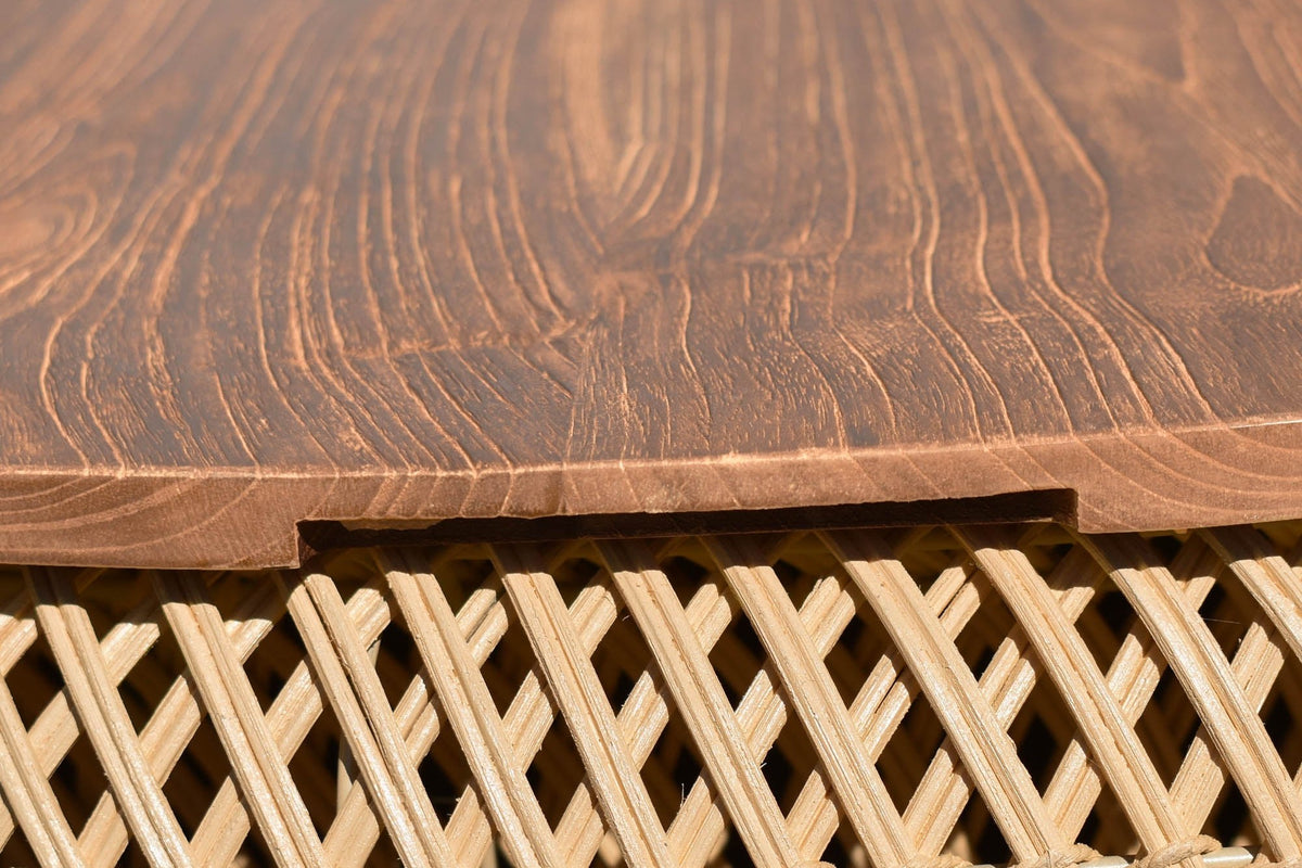 Halden teak top grain and the finger notch in the woven rattan rim