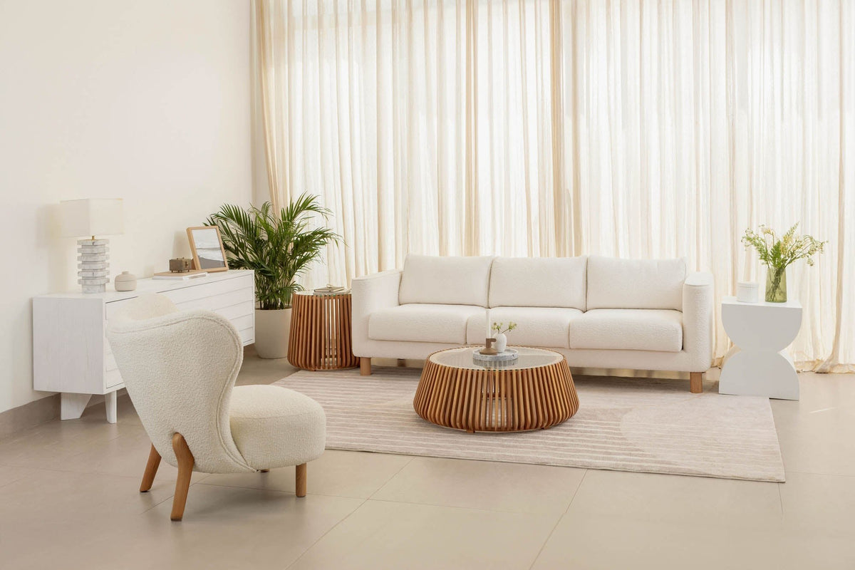 Hartley coffee table in a bright living room with sheer curtains
