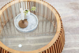 Top view of the Hartley table's glass top and slatted acacia rim