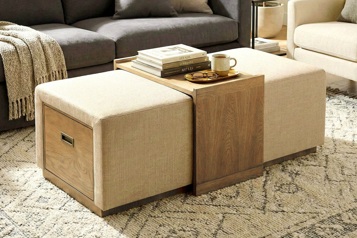 Helena storage ottoman as a coffee table in front of a grey sofa, tray holding books and tea