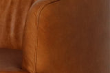 Close-up of the rounded arm and seat in Saddle buffalo leather