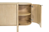Curved end door of the Ilaria sideboard opened to a rounded shelf