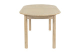 End view of the Ilaria table showing the rounded top and round legs