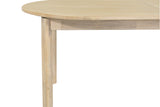 Close-up of the Ilaria table's rounded edge and round leg