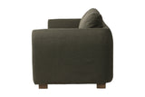 Isolde sofa side view showing the rounded arm and ash wood legs