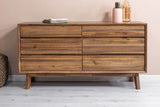 Keaton Warm Pecan dresser against a blush pink bedroom wall