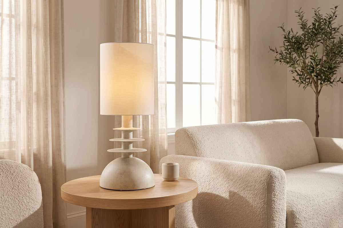 Kerensa table lamp on a round oak end table beside a cream boucle sofa
