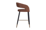 Lark counter stool, side view showing the open back and aged gold footrest