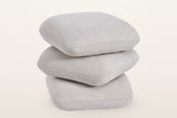 Lavagna ottoman in Beige with the top two pillows turned at an angle: they swivel