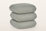 Lavagna square ottoman in Sage, three-quarter view on a warm white studio backdrop: three soft square pillows stacked