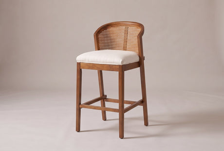 Lazise counter stool in a Walnut finish, three-quarter view on a warm grey studio backdrop