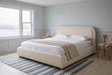 Lerici boucle bed in a pale blue bedroom with wainscoting, a harbour view and a striped rug
