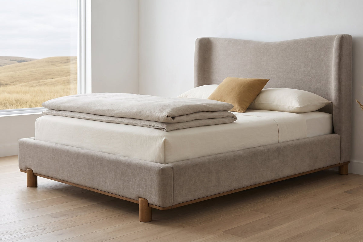 Lerma platform bed in dark beige with oatmeal linen in a bedroom in the Calgary foothills