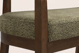 Close-up of the square walnut-finish front post, the seat rail joint and the green seat pad