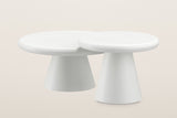 The two Levico coffee tables nested: the small table's higher top slid over the edge of the large top