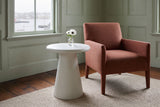 Levico round white side table beside a rust linen armchair in a sage-panelled Lunenburg sitting room, the harbour through the window
