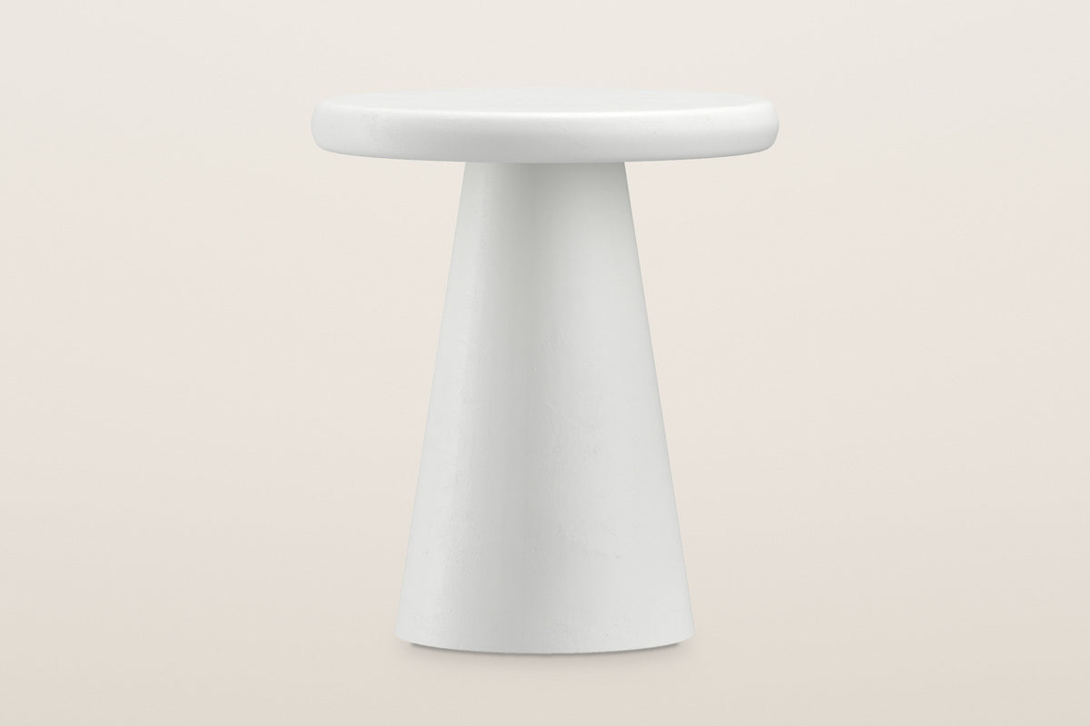 Levico side table at eye level: the round top over the tall straight-sided white cone