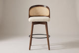 Locorotondo counter stool, straight front view: low barrel back with cane-look panel, cream woven seat, wood apron
