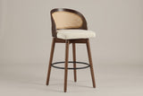 Locorotondo swivel counter stool, three-quarter view on a warm grey studio backdrop: walnut-finish curved back shell with a c