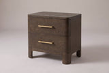 Lodi 2-drawer nightstand in Brown Oak, three-quarter view on a warm grey studio backdrop