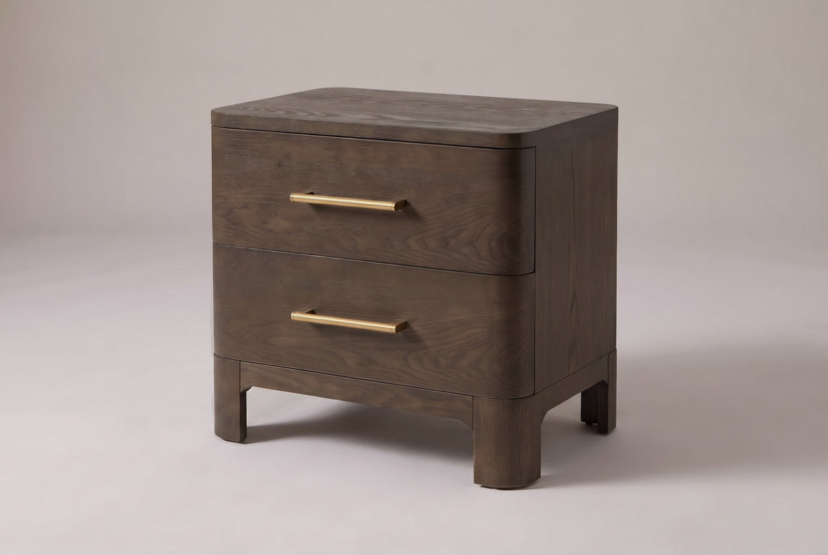 Lodi 2-drawer nightstand in Brown Oak, three-quarter view on a warm grey studio backdrop