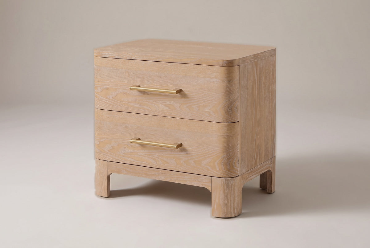Lodi 2-drawer nightstand in Natural, three-quarter view on a warm grey studio backdrop