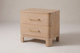 Lodi 2-drawer nightstand in Natural, three-quarter view on a warm grey studio backdrop