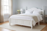 Loreto bed in white made up with white linen, in a pale blue Halifax bedroom with a sash window and white hydrangeas