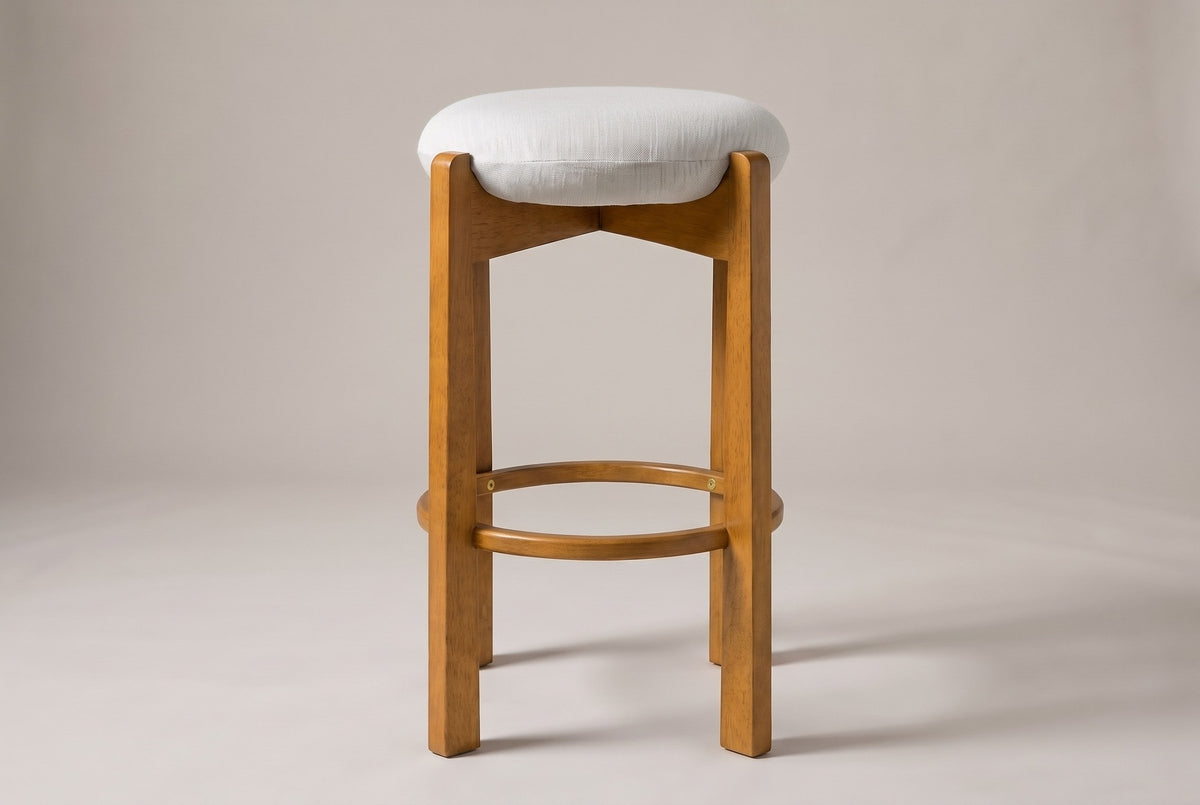 Lucera bar stool in Walnut, straight front view: thin round linen-look cushion, four square legs and a round footrest