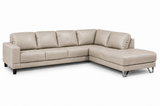 Lucien bisque leather sectional left bumper, wide track arms and cushion detail