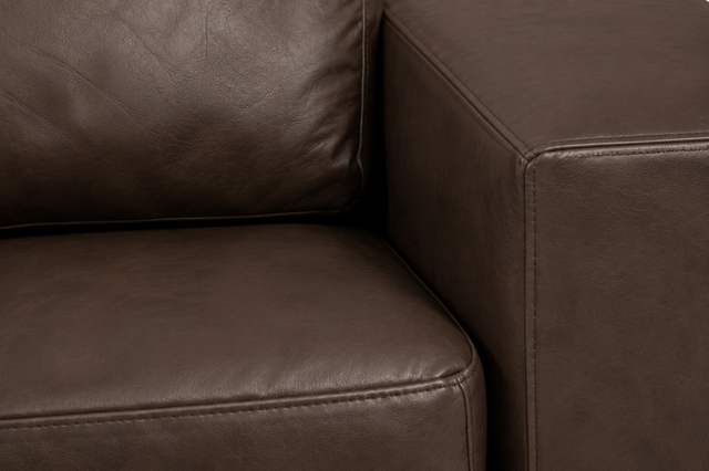 Lucien chocolate leather sectional left bumper, tailored seams and tufting detail