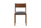 Lucrezia dining chair in the Walnut finish, seen from the front on a white background