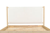 Close-up of the Manciano headboard: one off-white cushion hung between two round posts