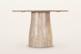 Marano dining table in Natural White Wash, level side view on a warm white studio backdrop: the pedestal narrow under the top
