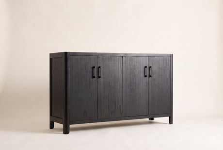 The Maren storage cabinet in Black, front three-quarter view: black-stained wood veneer doors with the grain showing, rounded corners and short legs, on an off-white studio background