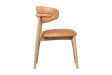 Marlow Hazelnut leather dining chair, side view of the curved back and ash frame