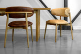 Marlow dining chairs in Tobacco and Hazelnut leather at a wood dining table