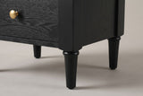 Close-up of a Marsala front leg: the chamfered corner stile and the turned, tapered leg