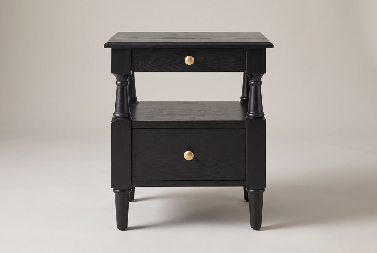 Marsala nightstand in Black, straight front view: two drawers with round gold-tone knobs, an open shelf on four turned posts