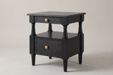 Marsala nightstand in Black, three-quarter view on a warm grey studio backdrop