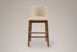 Menaggio counter stool, straight front view: one rounded beige back, a beige seat