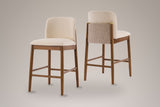 The set of two Menaggio counter stools on a studio backdrop: one from the front