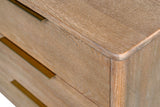 Rounded top corner of the Merritt dresser showing the oak grain
