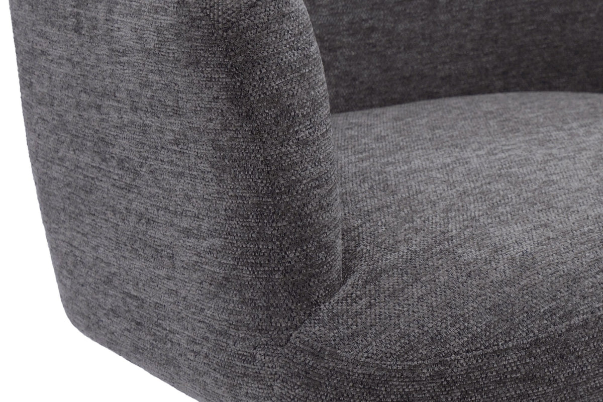 Close-up of the textured warm charcoal fabric on the Miles stool arm and seat