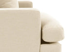 Close-up of the rounded Mombaruzzo seat cushion running past the arm, the base below and a tapered leg