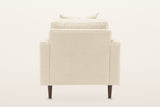 Mombaruzzo accent chair from behind on a warm white studio backdrop: a plain upholstered back on four tapered legs